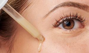 Woman Applying Face Serum