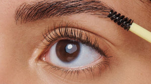 Woman Appling Eyebrow Makeup Product
